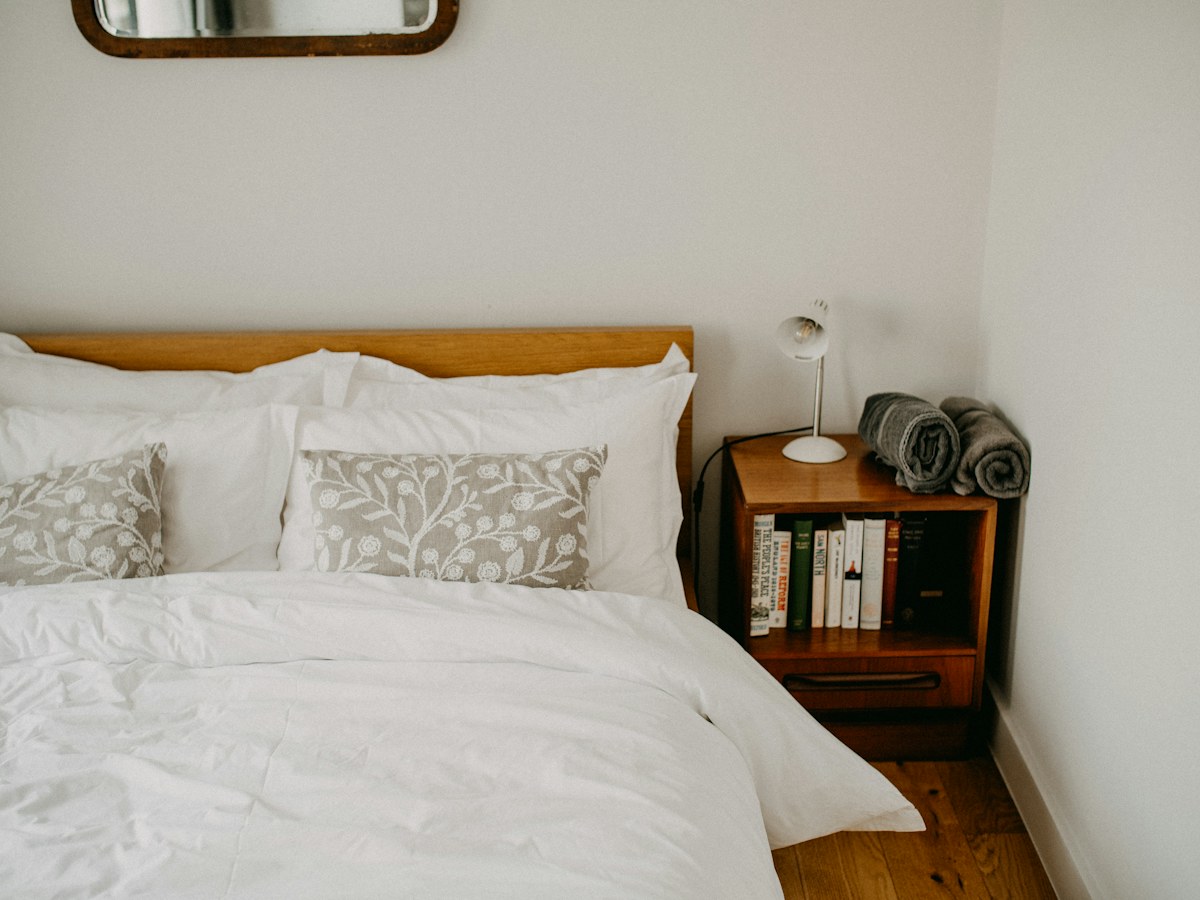 Cozy bedroom with a neatly made bed and bedside table